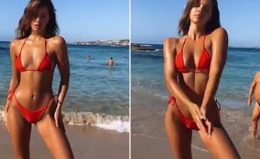 Modelja pozon para objektivit të aparatit, burri prapa shpinës së saj “fiton” vëmendjen e të gjithëve (Video)